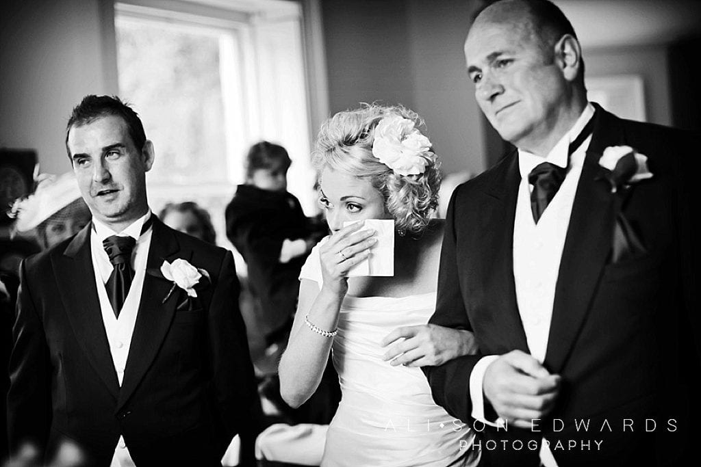 bride wiping away tears at shuttle hall wedding