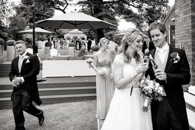 bride and groom checking glasses