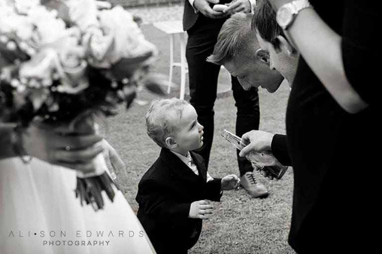 best men jokingly giving boy a drink at Old Vicarage Boutique