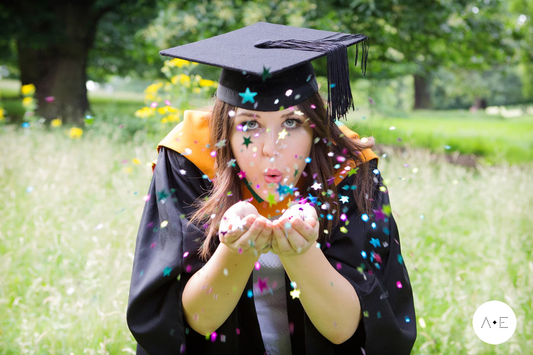 Nottingham graduation photographer - lady blowing confetti
