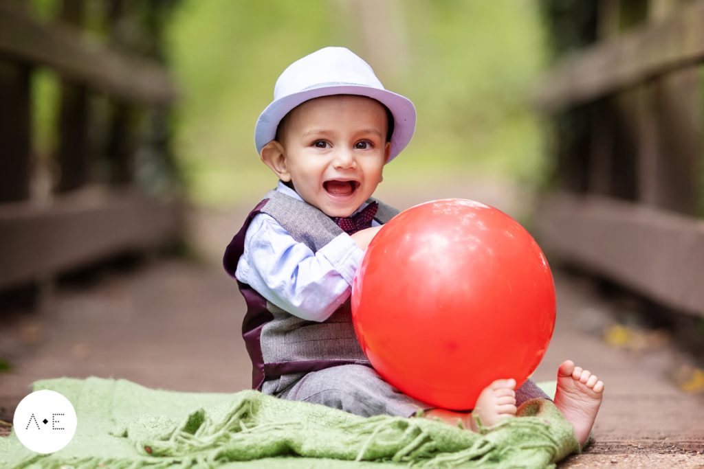 1 year old photoshoot boy laughing