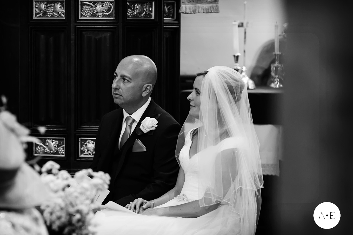 bride and groom at alter in Plumtree church Nottingham