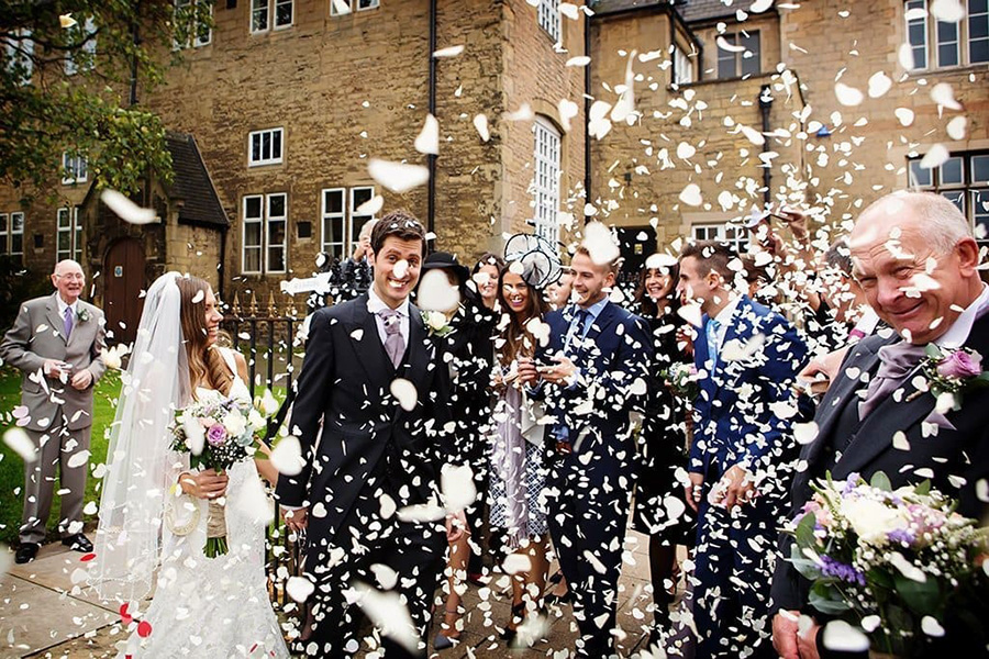 bride and groom confetti photo outside Nottingham church