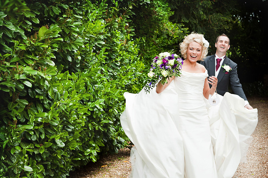 bride and groom laughing captured by stamford micro wedding photographer Alison Edwards