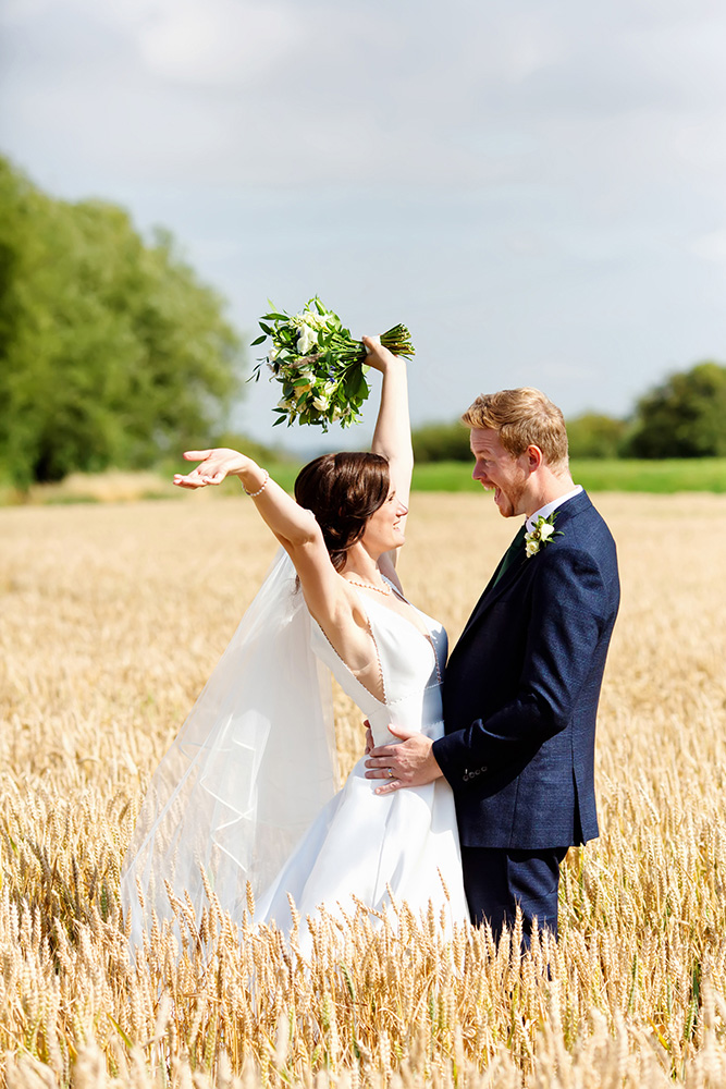 bride and groom in cornfield captured by burton on trent micro wedding photographer