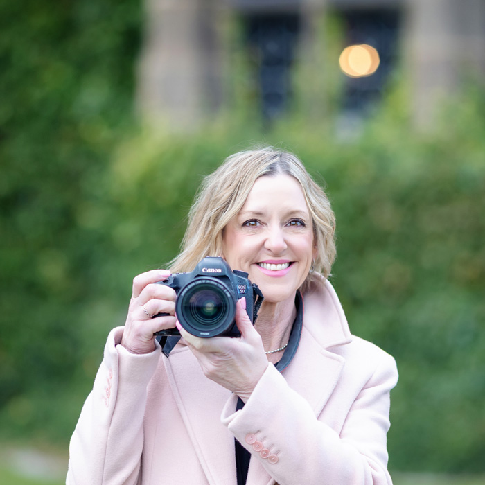 Burton on Trent micro wedding phtoographer Alison Edwards holding her camera