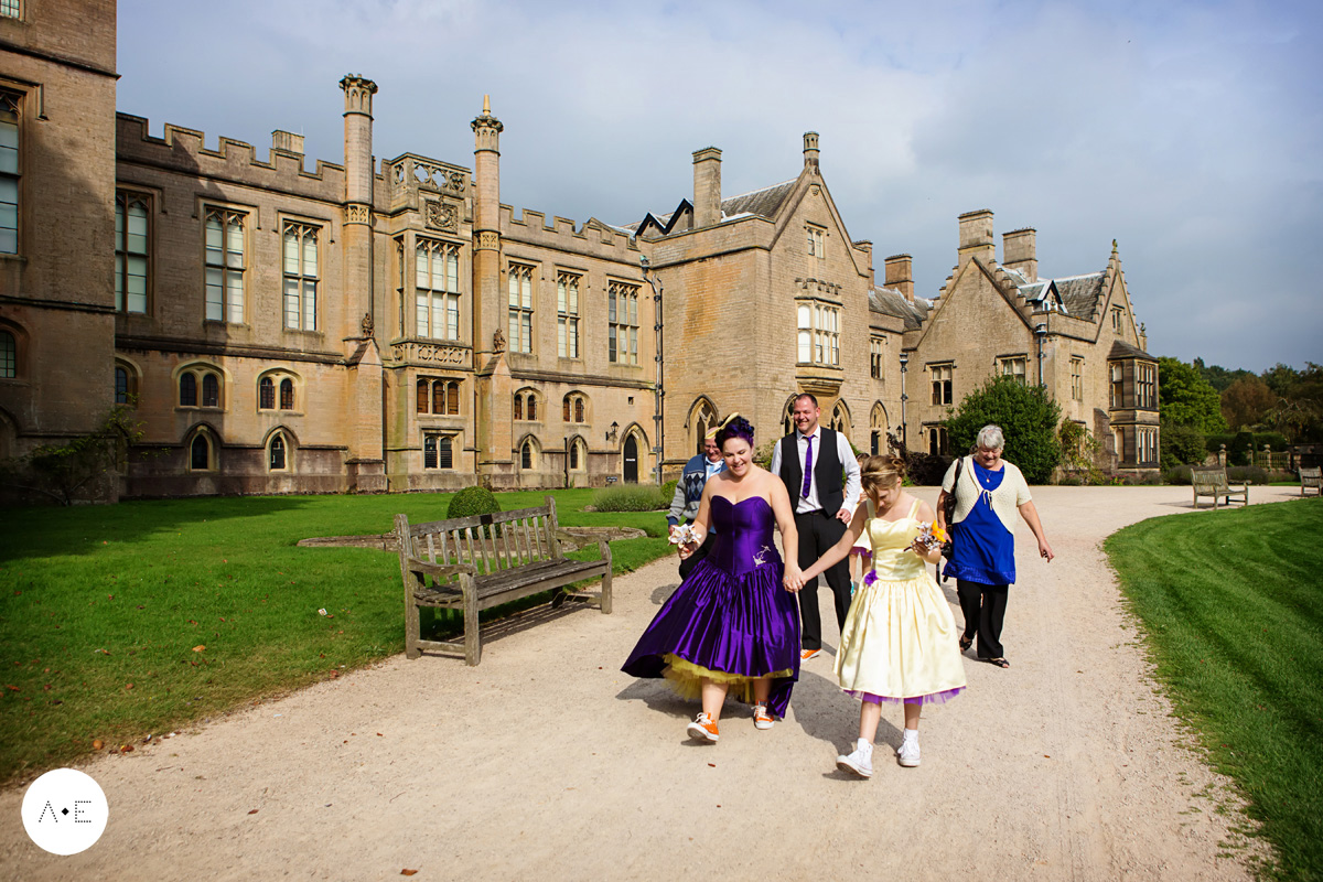 bride and groom and guests leaving newstead abbey captured by nottingham wedding photographer Alison Edwards Photography