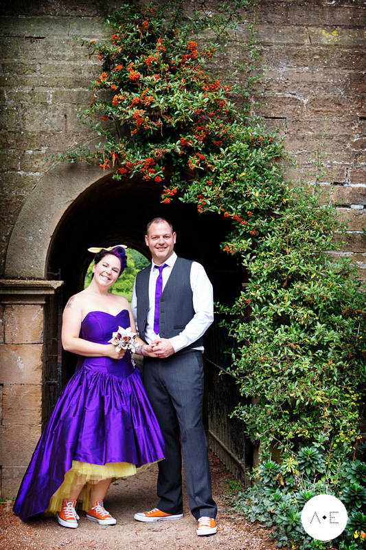 bride wearing purple wedding dress and groom at newstead abbey nottingham
