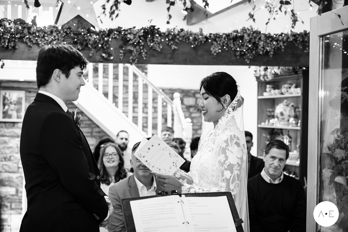 Bride and groom exchanging vows ceremony held at home in the Peak District