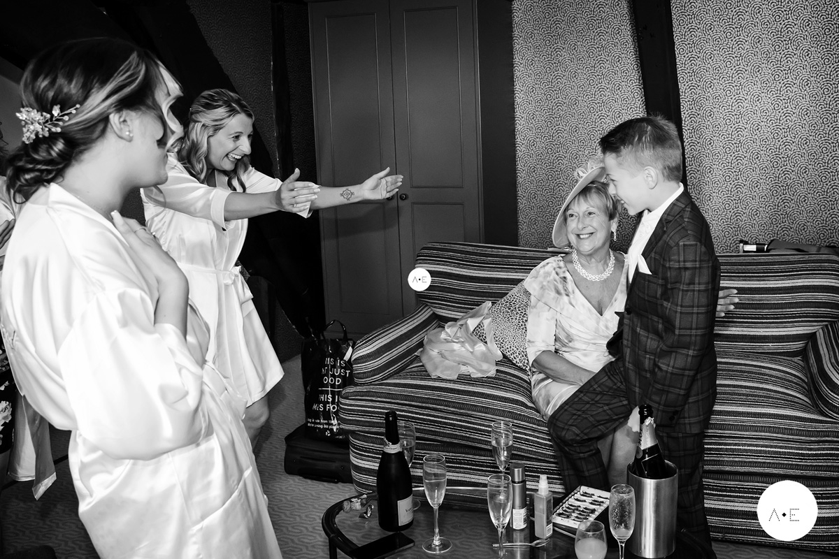 happy bride seeing her son before wedding taken by documentary wedding photographer Alison Edwards Photography