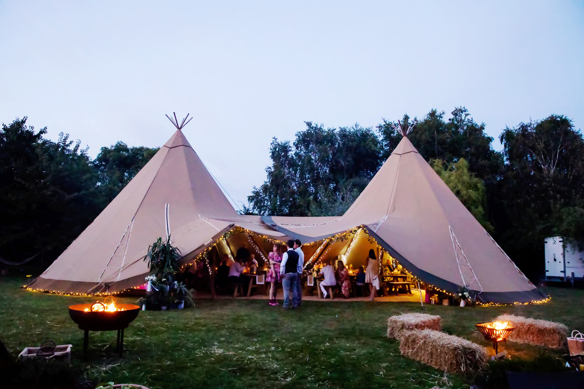 Wedding Tipis in garden captured early evening by twilight wedding photographer Alison Edwards Photography