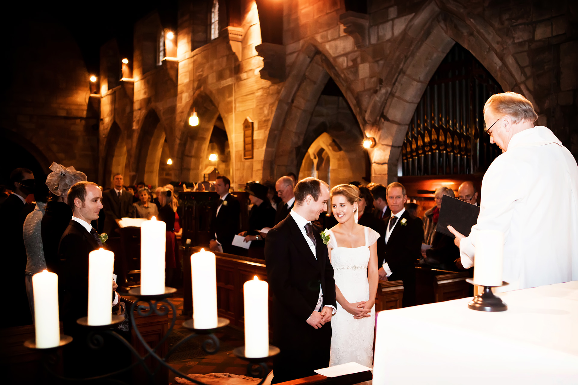 bride and groom in church captured by twilight wedding photographer Alison Edwards Photgraphy 