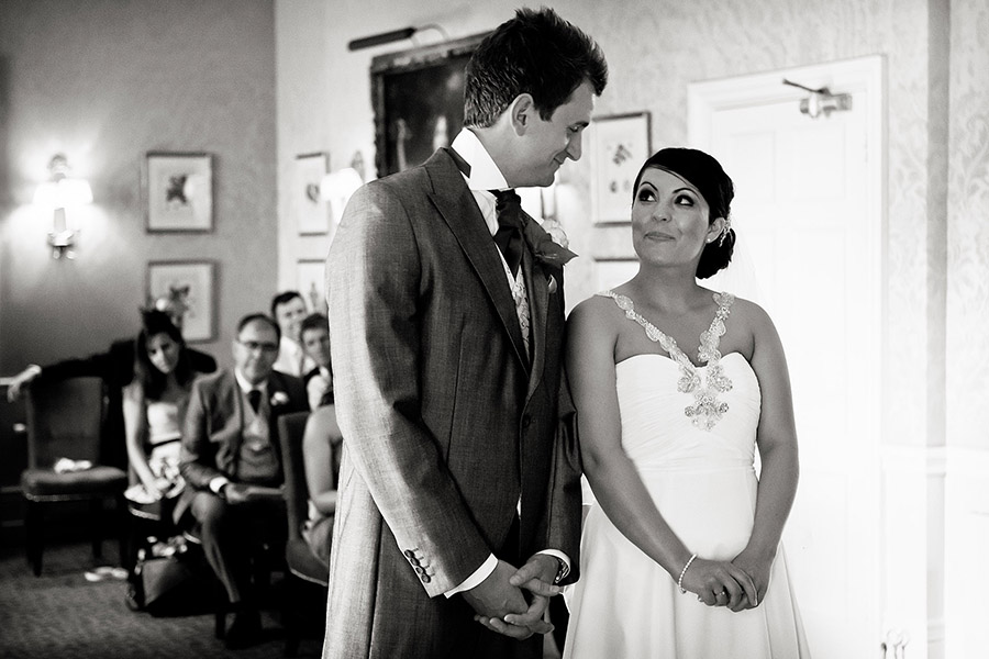 bride and groom smiling at the alter captured by Chesterfield micro wedding photographer 