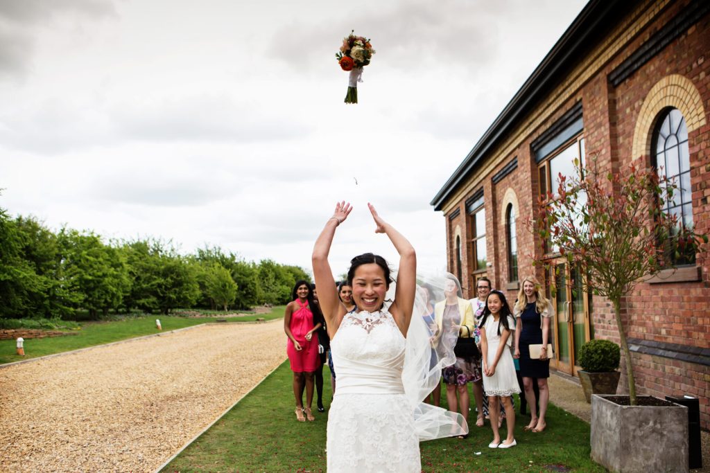 bride through bouquet photographed by Chesterfield wedding photographer
