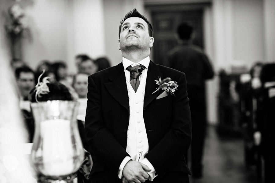 groom looking nervous waiting for bride photographed by Chesterfield wedding photographer