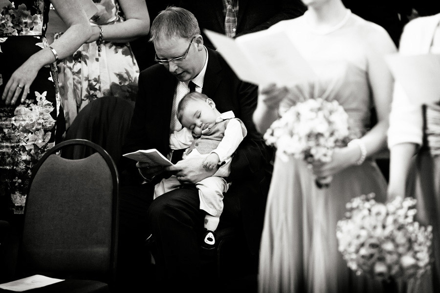 young boy falling to sleep photographed by Chesterfield wedding photographer