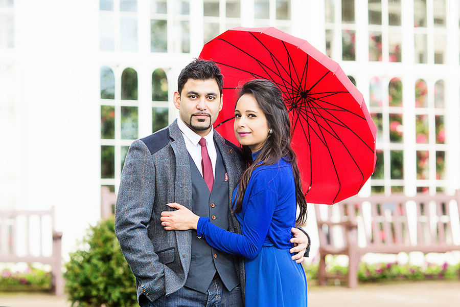 couple with red parasol on engagement shoot in Nottingham captured by Alison Edwards Photography