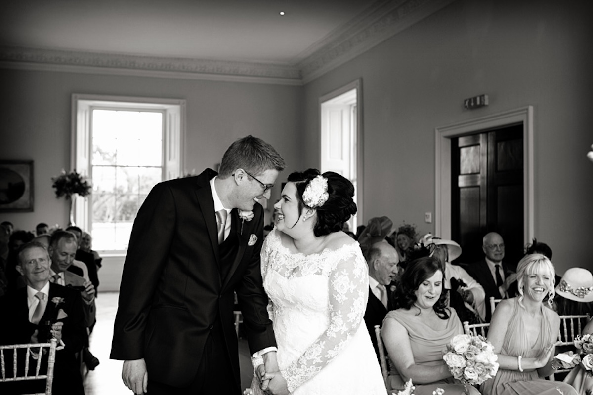 bride and groom laughing at Stubton Hall ceremony captured by Alison Edwards Photography