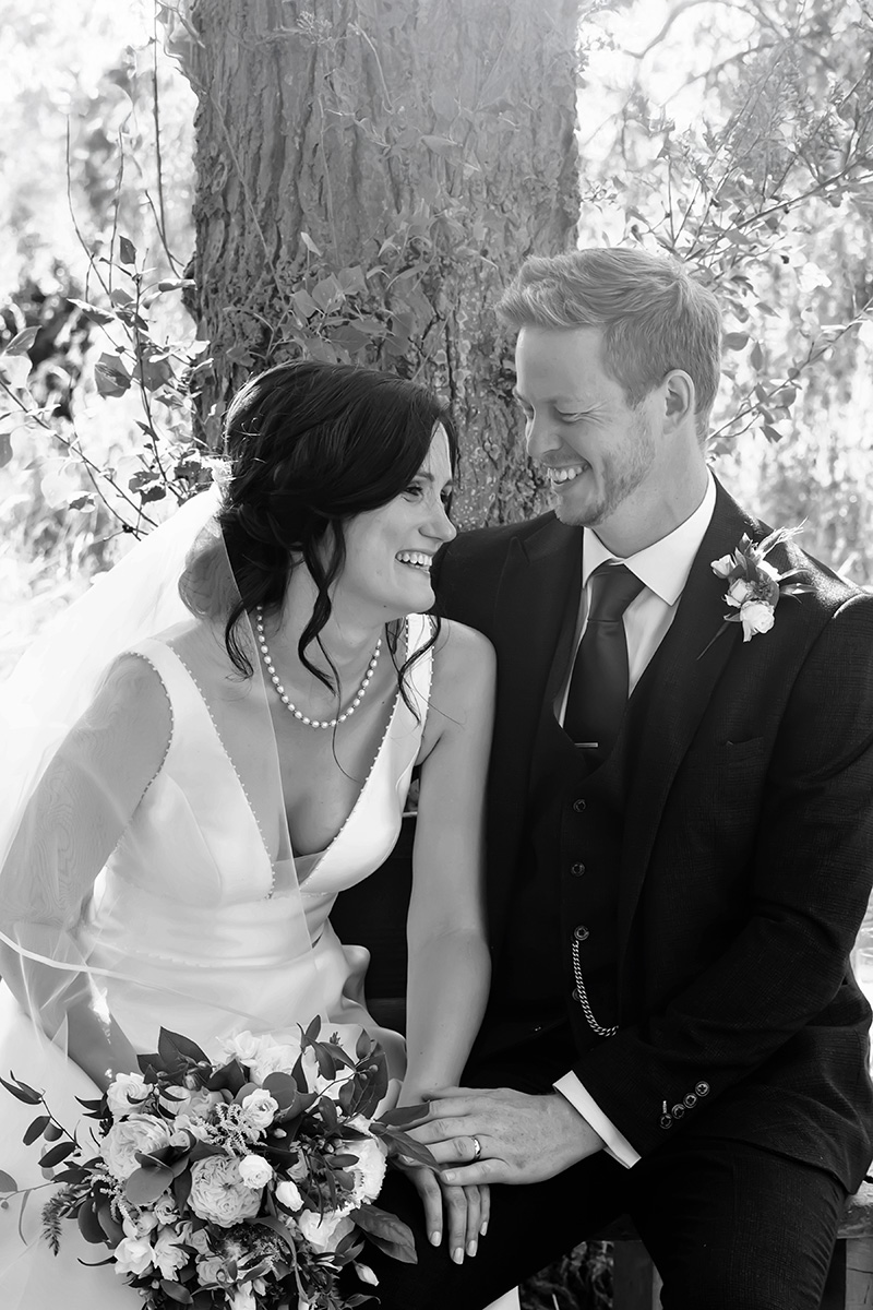 bride and groom laughing captured by Alison Edwards Photoraphy a Nottingham wedding photographer