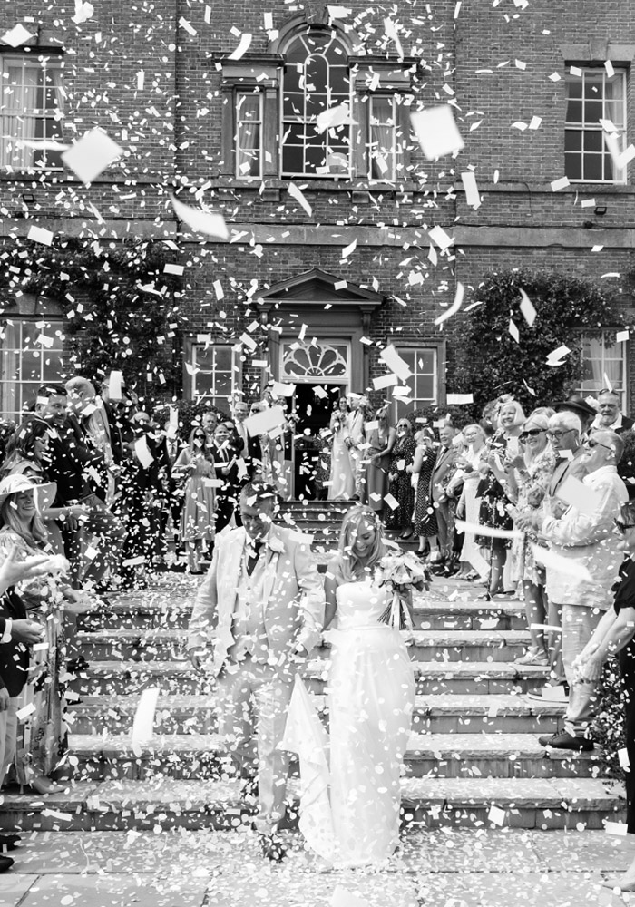 bride and groom showered with confetti at Norwood park nottingham